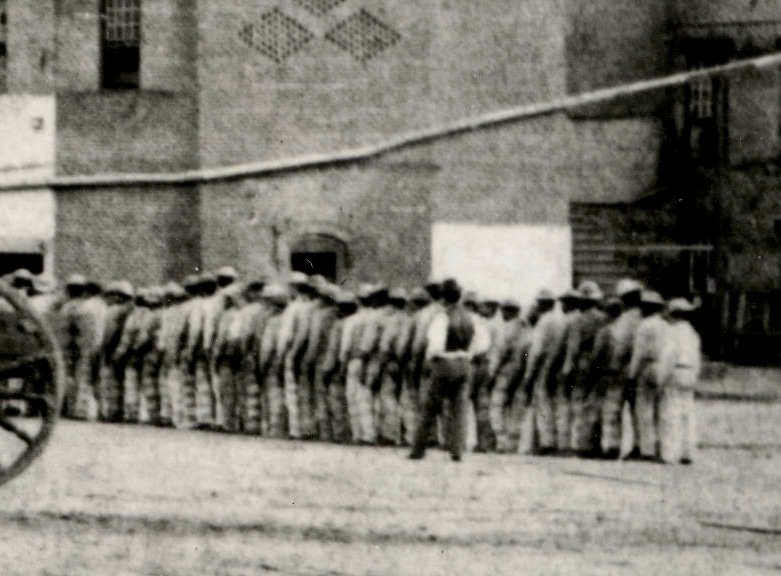 Close-up of Prison yard in Huntsville, circa 1873-1875, showing prisoners of color.